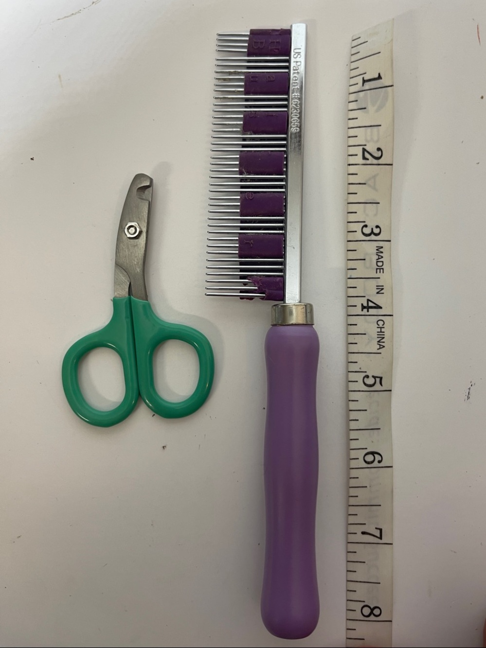 3/$10 Purple-Handled Pet Comb with Green Pet Nail Scissors